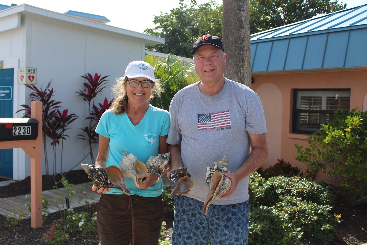 Guests Linda and David holding Horse Conch Shells