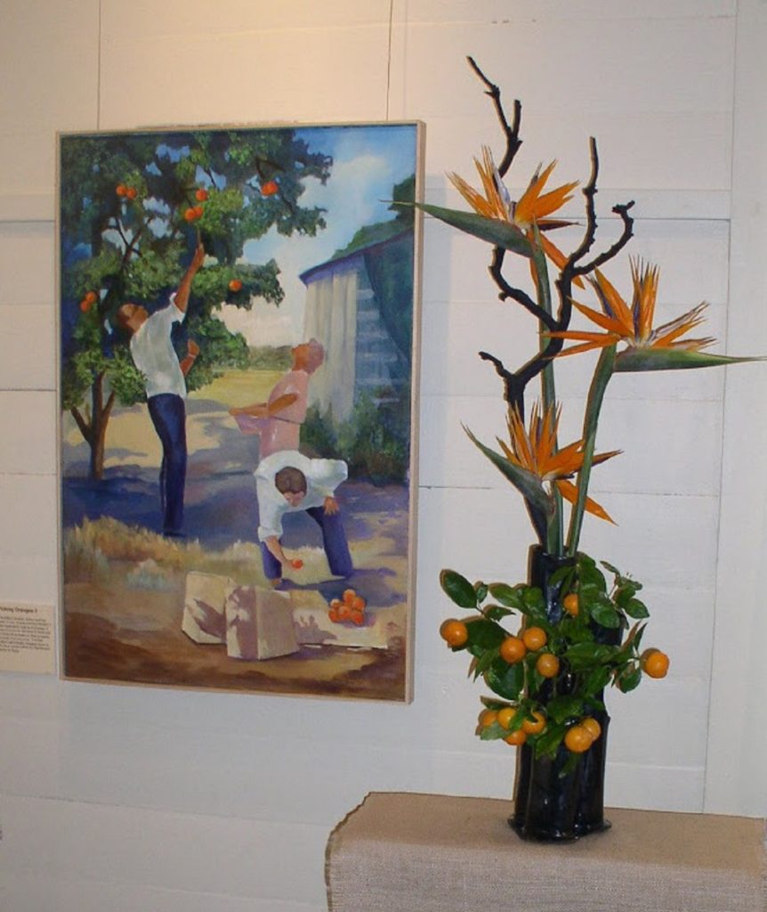 Art work next to an orange tree